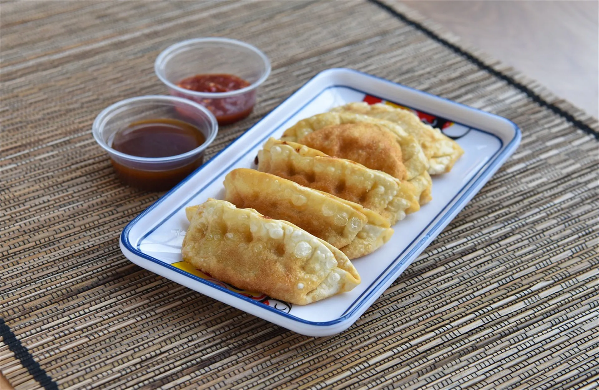 Pan‑fried dumplings with dips at Hot Wok, a Chinese Restaurant in Niles